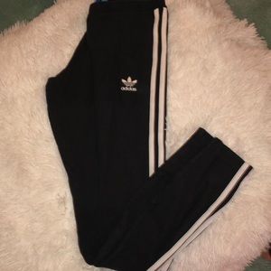 Black adidas pants with logo and stripes
